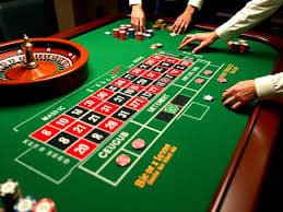 f9club Casino live dealer table with cards and chips on screen